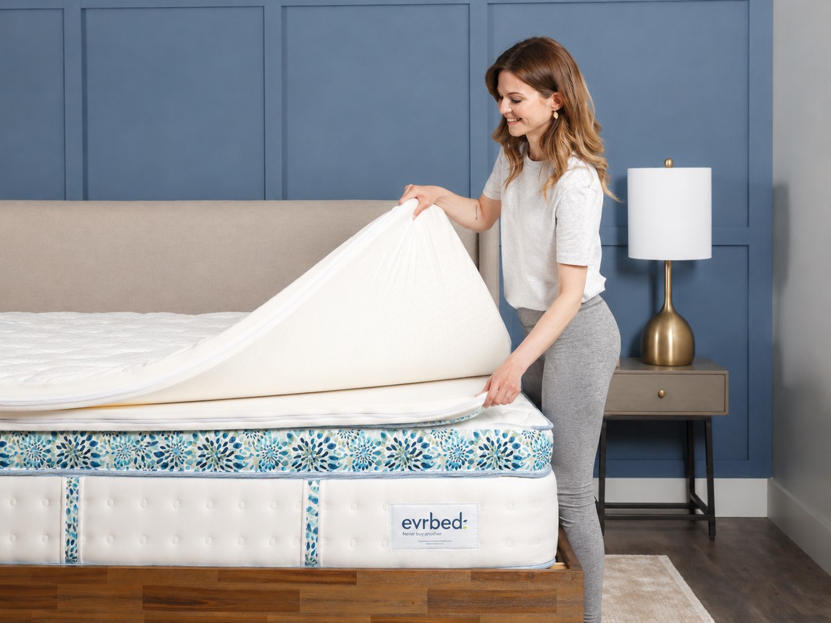 Person opening an Evrbed mattress to access its modular comfort layers